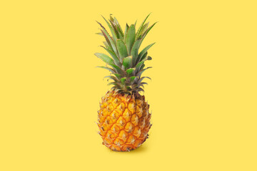 Isolated pineapple on a yellow background. Exotic fruits