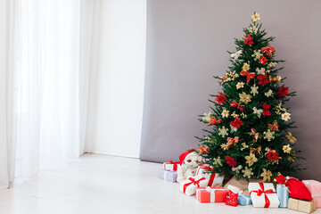 Christmas tree pine with gifts for the new year postcard white gray background decor