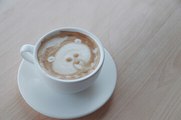 Cup of latte on wooden table. Latte Art. 