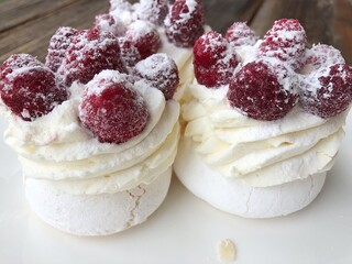 Anna Pavlova cake with cream and berries 