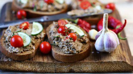 Sandwiches with pate on a wooden board. Healthy snack. Selective focus. Macro.