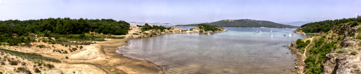 Fototapeta na wymiar Panorama picture of Sturic bay on Rab island in Croatia in the morning by in rainy weather