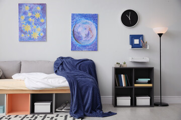 Modern teenager's room interior with comfortable bed and stylish design elements