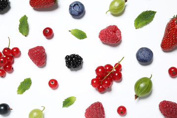Mix of fresh berries on white background, flat lay