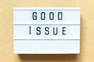 Lightbox with word good issue on wood background