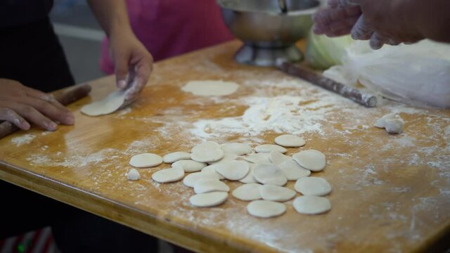 Prepare flour sheet for dim sum making of Xiao long boa soup dumplings