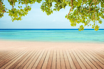 summer time tropical seascape with sandy beach and wooden table top montage photo of Summer beach concept