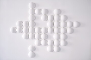 White ball ornament on a white wall.