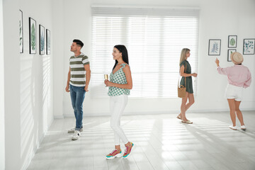 Fototapeta premium Group of people at exhibition in art gallery