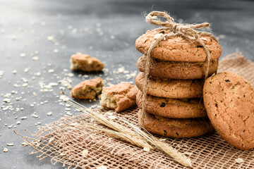 Homemade oatmeal cookies with raisins on a dark background