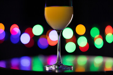 glass of champagne with bokeh background