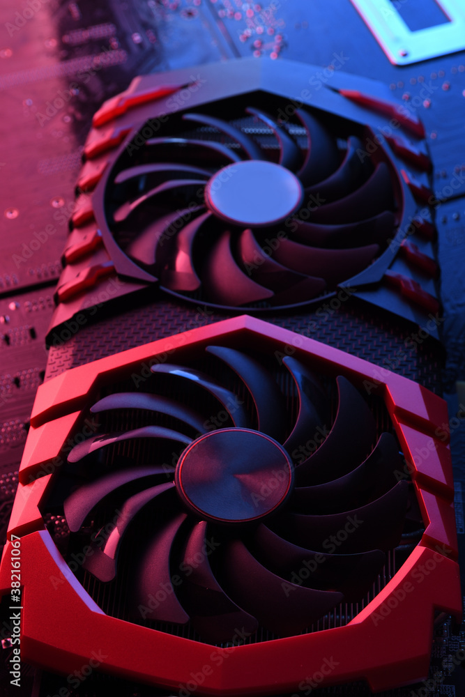 Poster computer game graphics card, videocard with two coolers on circuit board ,motherboard background. cl