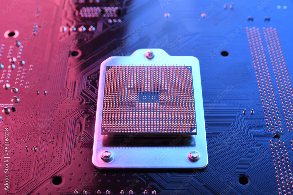 Poster computer cpu processor chip on circuit board ,motherboard background. close-up. with red-blue lighti