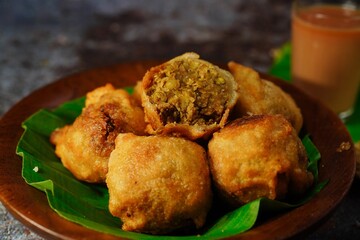 Sukhiyan - Kerala deep fried tea time snack with green gram filling, selective focus