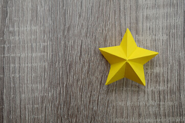 A folded yellow paper star