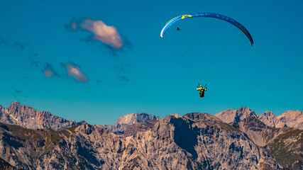 Beautiful alpine view with a paraglider at the famous Rofan summit, Maurach, Achensee, Pertisau, Tyrol, Austria