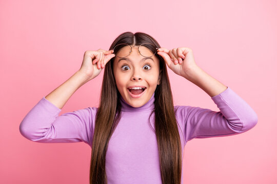 Close-up portrait of her she nice attractive pretty amazed glad cheerful long-haired girl learner nerd touching specs academic science having fun isolated over pink pastel color background