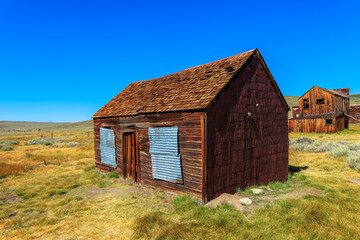 Fototapeta premium Ancient 1800s building in Bodie state historic park, California Ghost Town. United States of America, close to Yosemite national park.