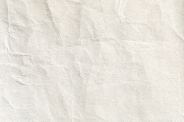 Crumpled paper light beig surface texture 
