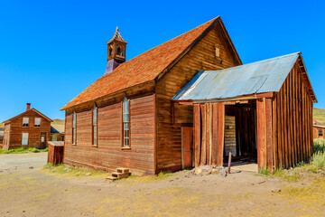 Fototapeta premium Methodist Church of 1882 with bell tower of the antique Fuller street, Californian Ghost Town, close to Yosemite national park. Bodie state historic park, California, United States of America