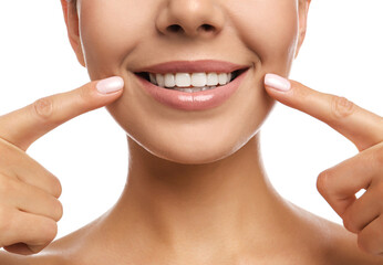 Young woman with beautiful smile on white background, closeup. Cosmetic dentistry