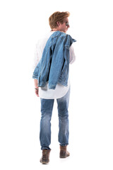 Behind view of stylish young handsome man carrying jeans jacket looking away. Full body isolated on white background.