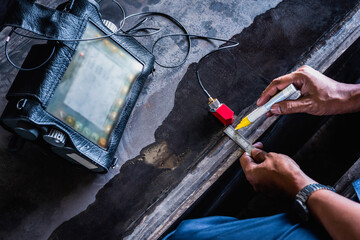 UT, Ultrasonic testing to detect imperfection or defect in welding of steel structure outside. NDT...