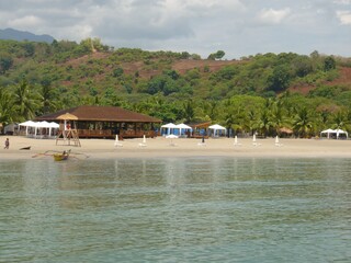 Beautiful view of the beach the green forest and blue sky