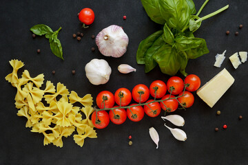 Ingredients for pasta on a black background