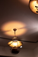 Fototapeta na wymiar cafe lamp yellow illumination lighting dark loft interior object vertical picture concept