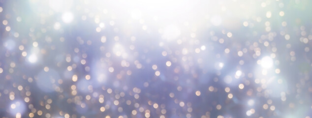 Golden bokeh background with blurry blue lights. Holiday festive background. Christmas, winter and new year banner