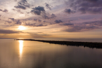 Fototapeta na wymiar Sunset over Lake Huron bay in summer in Michigan