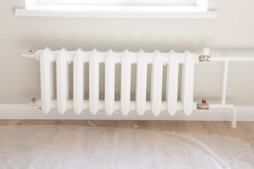 white heating radiators in a new apartment