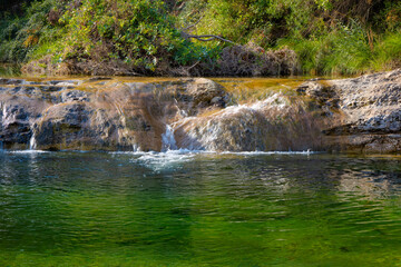 View of a waterfall of the Ulldemó river on the Pesquera route in Beseit, Matarranya, Aragon, Spain