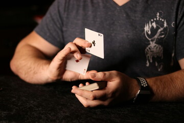 card magician practicing sleight of hand magic Cardestry