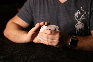 card magician practicing sleight of hand magic
