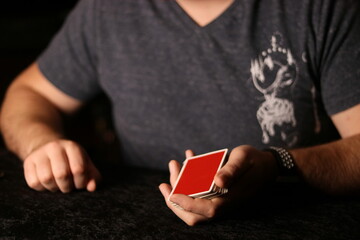 card magician practicing sleight of hand magic