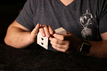 card magician practicing sleight of hand magic
