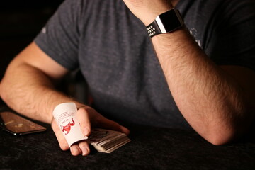 card magician practicing sleight of hand magic