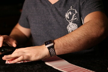 card magician practicing sleight of hand magic