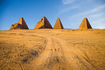 Fototapeta na wymiar Road leading to pyramids in Sudan at daylight.