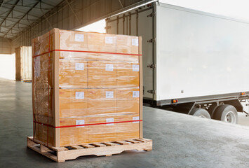 Packaging Boxes Wrapped Plastic Film on Pallet Loading into Shipping Cargo Container. Supply Chain. Trucks Parked Loading at Dock Warehouse. Shipment Logistics. Cargo Freight Truck Transport.	