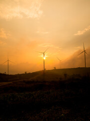 Obraz premium Many wind turbines are located on the hill to generate clean energy, Sent to use in the city