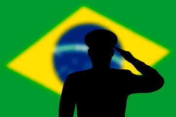 Solder silhouette on blur background with Brazil flag.