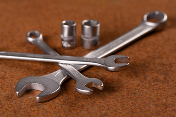 Set of tools on rusty background.