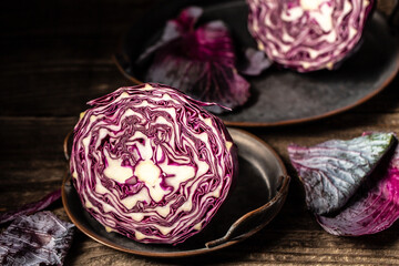 Fototapeta premium Shredded red cabbage Prepare sliced vegetable for cooking purple cabbage salad or coleslaw. Homemade food concept. Vegetarian healthy food
