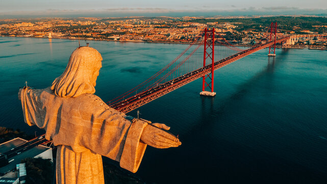 Aerial view of Sanctuary of Christ the King, Santuario de Cristo Rei in Lisbon, Portugal. Drone photo at sunrise. Catholic monument