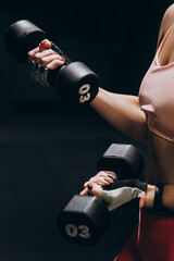 woman exercising with dumbbells