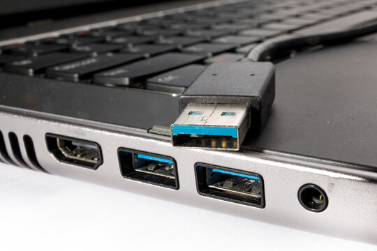 macro closeup of a USB 3.0 plug and jack on a notebook computer