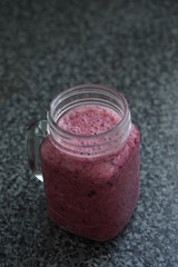 Red berry smoothie in a jar